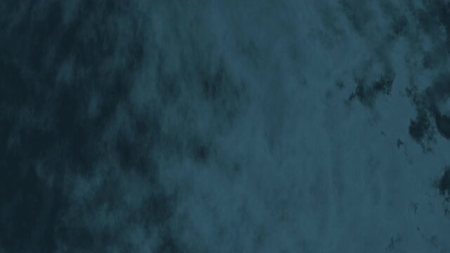 Animated dark teal cloudy background with soft fog texture. Ideal for overlays, intros, presentations, websites, titles, and cinematic motion graphics.