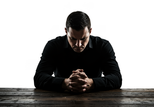 Man deep in thought praying with hands clasped on a textured surface transparent background