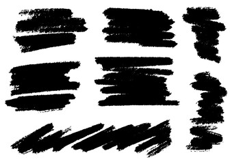 Collection of nine black brush stroke elements on a white background