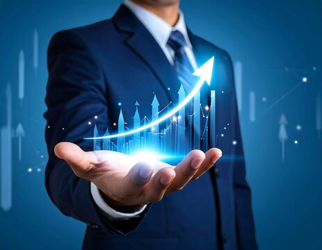 Businessman holding upward graph projection