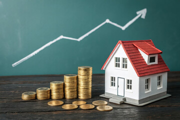 Rising house prices and investment growth with a miniature home and coins