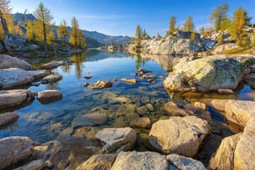 Serene alpine lake, clear water, rocky shore, golden light