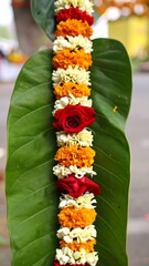 Floral garland on large leaf