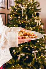 Festive Gingerbread Cookies by Christmas Tree