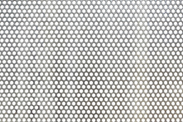 grey perforated steel sheet, holes pattern on metal plate with rough texture paint