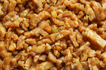 pieces of fried tempeh that are golden in color.  The texture of the soybeans is crunchy and tasty