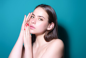 Fototapeta premium Beautiful sensual woman with clean skin, natural make-up on studio background. Portrait of beautiful girl with perfect skin. Beauty natural woman. Pretty woman face. Beauty sensual young model.