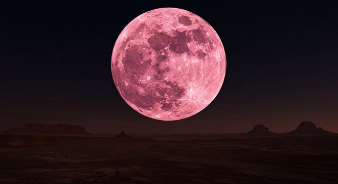 Stunning pink moon illuminates vast desert landscape under starry night sky