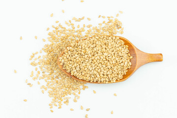 White Sesame Seeds in Wooden Spoon Closeup