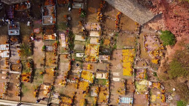 Drone timelapse over Day of the Dead cemetery with marigold flowers