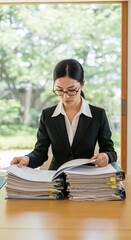 Serious Businesswoman Reviewing Documents: An professional, meticulously reviews an extensive stack of documents in a modern office, embodying focus and diligence.