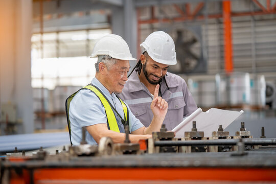 Collaboration in manufacturing industrial workshop business meeting factory environment close-up knowledge sharing