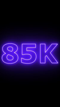 Glowing neon 85K light text animation. Shining neon number motion graphic for 85K followers and subscribers celebration.Social media milestone achievement neon effect video on black background. 4k