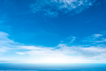 Fototapeta premium Nature of the ocean and blue sky Summer with sunshine, sandy beaches, clear blue waters sparkling against the blue sky. on an island with good ecology and environment Background for summer vacation