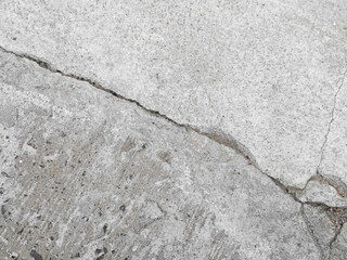Crack wall texture background broken earthquake effect, whtie grey building cement damage pattern plaster grunge black line paint surface abstract, construction rough street concrete backdrop.