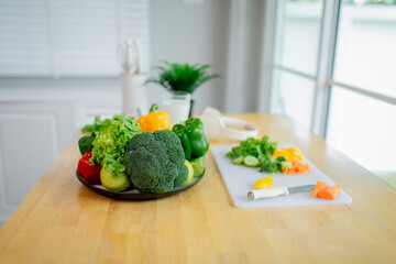 A joyful child and woman indoors holding glasses of milk, smiling happily, symbolizing health, freshness, nourishment, and a positive lifestyle.
