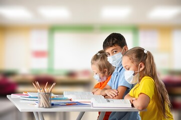 Children reading books sitting for table