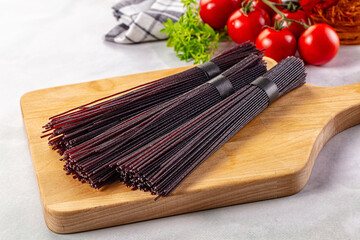 Raw black rice noodles lines