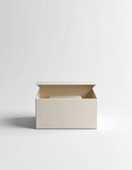 An open beige box with subtle texture sits on a white background, bathed in bright light, suggesting simple elegance and minimalist presentation