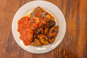 Grilled fish with Tomato Pepper stew and Plantain