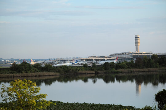 Washington National Airport on an overcast day with United Airlines and American Airlines planes on the tarmac