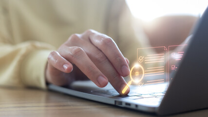 Hand typing on a laptop with an AI digital document checklist, online data analysis, verification, and artificial intelligence technology for modern business and productivity.