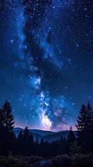 A mesmerizing nightscape displays the Milky Way glowing above dark, silhouetted evergreen trees in a remote forest valley