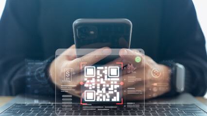 Businessman using smartphone with QR code payment and mobile banking icon for digital wallet, online transaction, fintech security, and cashless society technology.