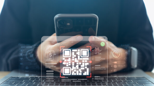 Businessman using smartphone with QR code payment and mobile banking icon for digital wallet, online transaction, fintech security, and cashless society technology.