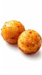 Two golden-brown, textured, rounded food items, perhaps small potato balls, displayed on a bright white background casting a soft shadow