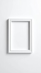 Simple white frame on a bright white wall, casting soft shadows. The frame has a classic, slightly ornate design