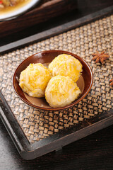 Traditional Chinese Steamed Dumplings in Ceramic Bowl on Bamboo Tray with Star Anise Asian Dim Sum Cuisine