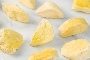 Freeze-Dried Durian Fruit Pieces - Golden Crispy Asian Specialty Snacks on White Background