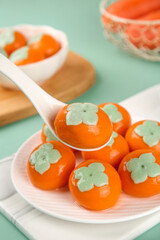 Orange Glazed Asian Dumplings with Green Flower Decorations on White Plate Traditional Gourmet Food