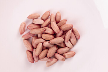 Raw Peanut Kernels Without Red Skin on White Background