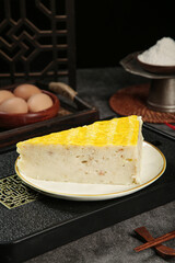 Macheng Meat Cake Slice Traditional Hubei Chinese Specialty Food with Golden Topping and Kitchen Ingredients