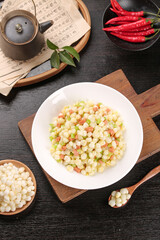 Fried Corn Kernels with Ham and Vegetables Traditional Asian Dish on Wooden Board