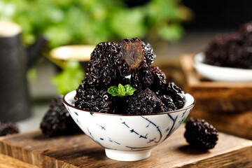 Black Jujubes Dried Fruit from Xinjiang China in Ceramic Bowl - Traditional Healthy Snack Showcase