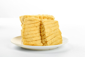 Dried Bean Curd Tofu Skin Slices on White Plate - Asian Vegetarian Food Ingredient