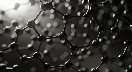 Molecular structure model with black and gray spheres connected by bonds in grayscale macro close-up science chemistry background