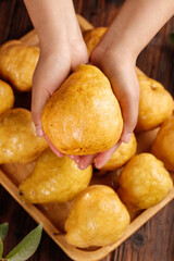 Fresh Golden Asian Pear in Hands from Wooden Basket - Autumn Fruit Harvest Concept