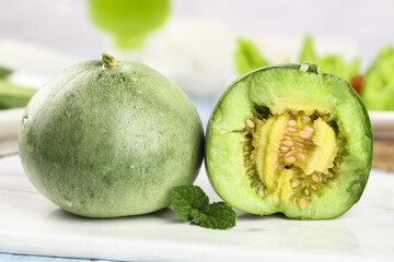 Fresh Green Shandong Melon Cut in Half on White Background