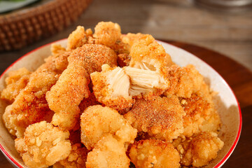 Golden Crispy Chicken Nuggets on Platter - Delicious Fried Snack Food with Salt Seasoning