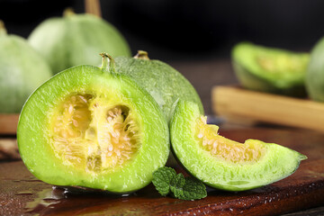 Fresh Green Melon Slices with Seeds on Wooden Board - Healthy Fruit Display