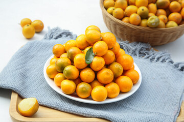Fresh Kumquats from Guangxi China - Crisp Citrus Fruits on Plate and Bowl