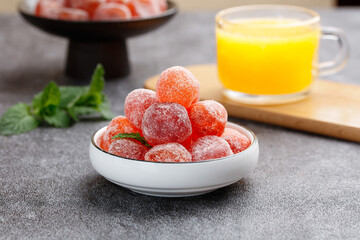 Candied Kumquats in White Bowl with Orange Juice and Fresh Mint - Preserved Fruit Snack Display