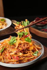 Sauteed Shredded Bamboo Shoots with Chopsticks - Traditional Asian Cuisine