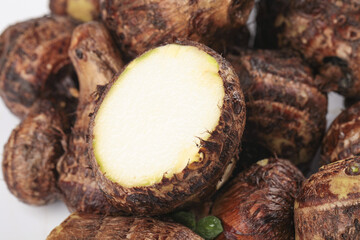 Fresh Small Taro Roots from Shandong China Showing White Flesh Interior for Cooking