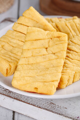 Dried Tofu Bean Curd Slices on Plate - Traditional Asian Food Ingredient
