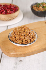 Japanese Natto Fermented Soybeans with Mixed Grain Dishes and Gazpacho on Wooden Table
